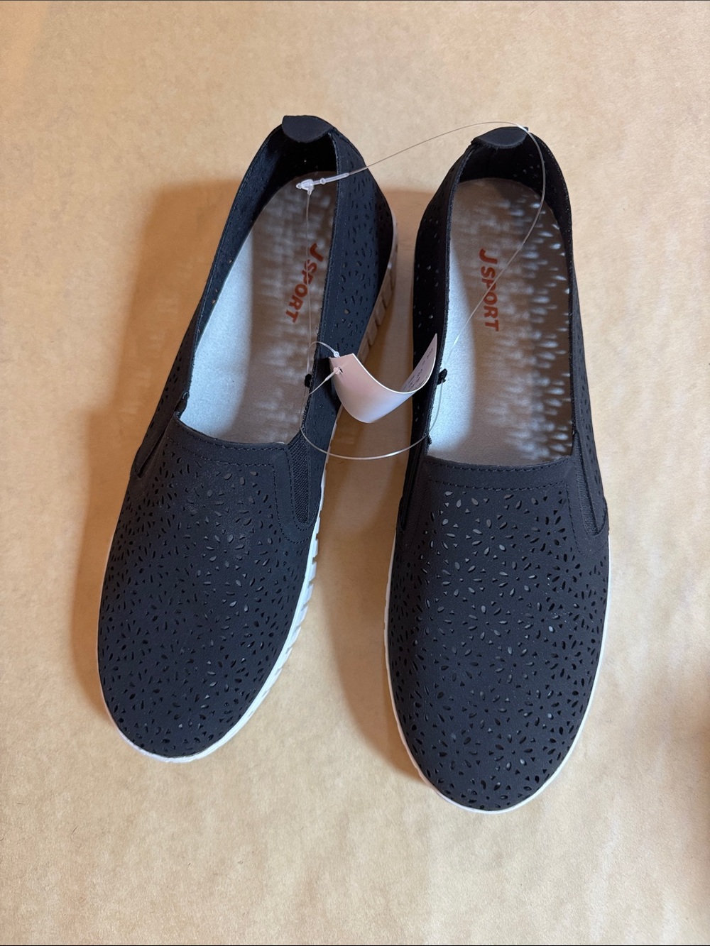J Sport Women's Black Laser-Cut Slip-On Sneakers